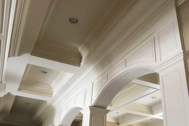 Inspiration for a mid-sized timeless dark wood floor and brown floor hallway remodel in Chicago with brown walls