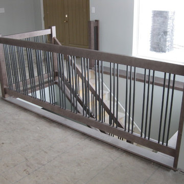 New Construction - Contemporary Maple Railings with Metal Spindles