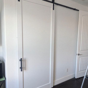 Lucia 1299 White Barn door with black hardware and softcloses