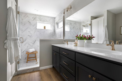 Example of a mid-sized transitional master gray tile gray floor and double-sink bathroom design in Minneapolis with shaker cabinets, black cabinets, quartzite countertops, white countertops and a built-in vanity