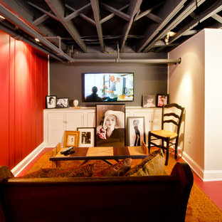 Inspiration for a medium sized eclectic fully buried basement in DC Metro with red walls, concrete flooring, no fireplace and red floors.
