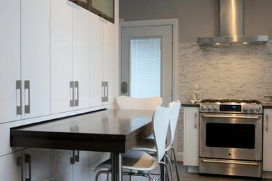 Photo of a mid-sized contemporary l-shaped separate kitchen in Ottawa with an undermount sink, flat-panel cabinets, white cabinets, quartz benchtops, grey splashback, matchstick tile splashback, stainless steel appliances, porcelain floors, with island and beige floor.
