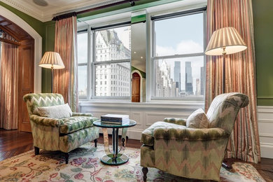 Inspiration for a mid-sized timeless formal and enclosed medium tone wood floor living room remodel in New York with green walls