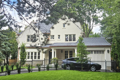 Example of a classic three-story exterior home design in Toronto
