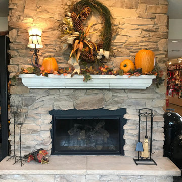 gas fireplace with stone, hearth and mantel