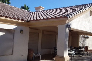 White one-story stucco house exterior photo in Las Vegas with a tile roof