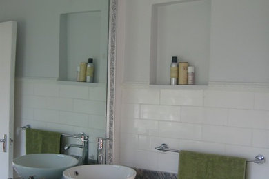 Example of a mid-sized transitional home design design in Other