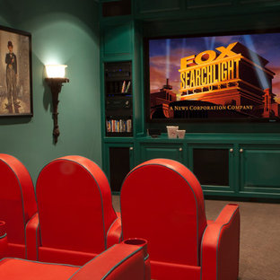 This is an example of a small classic enclosed home cinema in Houston with green walls, carpet and a projector screen.