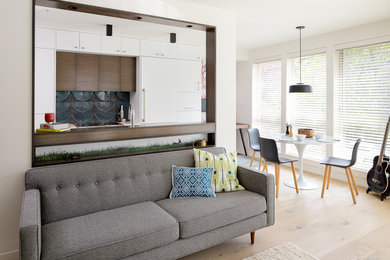 Living room - small 1960s formal and open concept light wood floor and white floor living room idea in Other with white walls and no fireplace