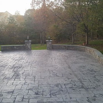 T-Stamped concrete patio, flagstone wall with columns