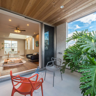 福岡のアジアンスタイルのおしゃれなテラス・中庭 (コンクリート敷き	、張り出し屋根) の写真