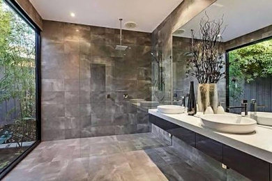 This is an example of a contemporary bathroom in Adelaide with an open shower.