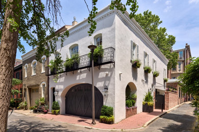 Large contemporary beige two-story stucco house exterior idea in Philadelphia
