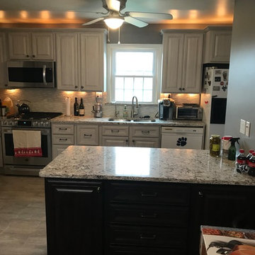 cabinet refacing-----grey with a black island and quartz countertops
