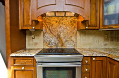 Stainless steel backsplash behind stove