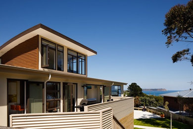 Modern two-storey house exterior in Wellington with wood siding.