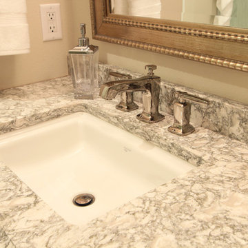 Polished Nickel 8" Spread Vanity Faucet with Cambria Countertop and Gold Mirror