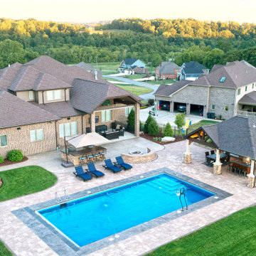 Custom Backyard with Pool House in Penn Trafford