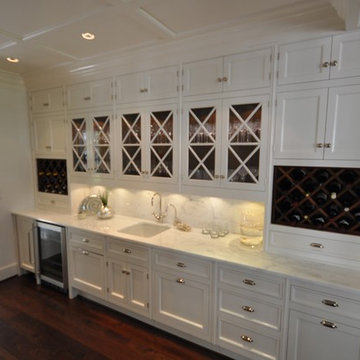 Signature Kitchen with custom made hardware, hand painted with high gloss paint.