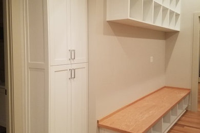 white cabinets/oak wood accent pieces.