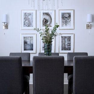 Foto di una sala da pranzo aperta verso il soggiorno moderna di medie dimensioni con nessun camino e soffitto a cassettoni