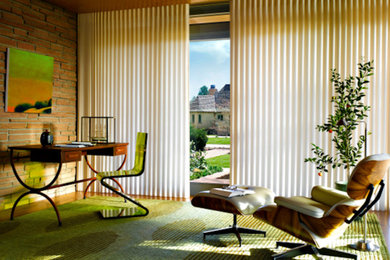 Inspiration for a mid-sized freestanding desk study room remodel in Kansas City with brown walls