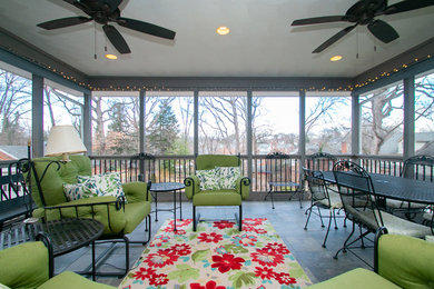 Inspiration for a craftsman tile screened-in back porch remodel in Other with a roof extension