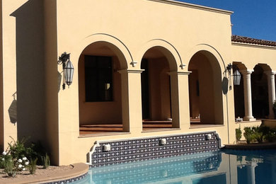 Example of a tuscan exterior home design in Phoenix