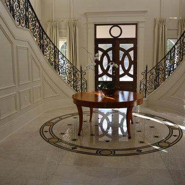 Crema Marfil MARBLE tiles, stairs, countertops and fireplace in mansion
