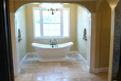 Example of a large tuscan master beige tile and stone tile travertine floor bathroom design in DC Metro with an integrated sink, furniture-like cabinets, dark wood cabinets, granite countertops, a two-piece toilet and beige walls