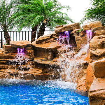 Tropical Style Rock Waterfall with Pool and Raised Spa in Delray Beach, Florida