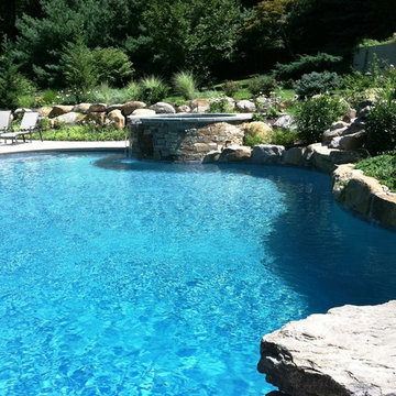 Upper Saucon Township custom built pool with raised spa, waterfall, & boulders