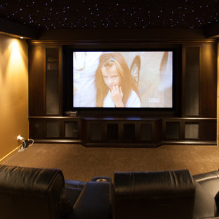 Inspiration for a contemporary enclosed carpeted home theater remodel in Gold Coast - Tweed with yellow walls and a media wall