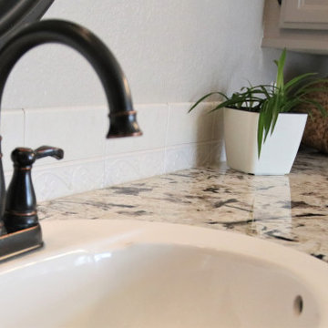 Alaska White Granite Countertops On Painted White Vanity Cabinets