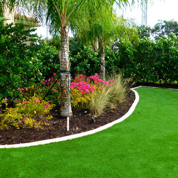 Hedged in Artificial Turf Backyard