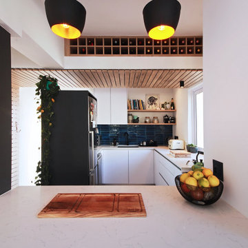Contemporary Kitchen with Canopy and Bulkhead Wine Storage