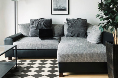 Living room - contemporary vinyl floor and multicolored floor living room idea in Other