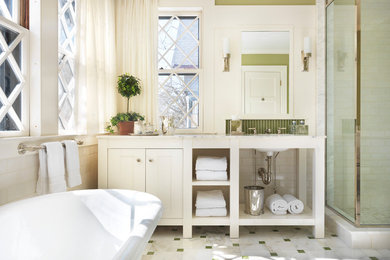 Design ideas for a traditional bathroom in Boston with a freestanding tub, marble benchtops, subway tile and green walls.