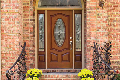 Inspiration for a mid-sized timeless red two-story brick house exterior remodel in Philadelphia