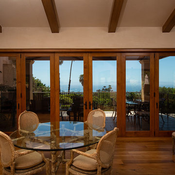 Folding Door Systems Create Open-Air Dining in a Spanish Style Home