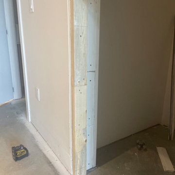 Custom shelving and hidden door