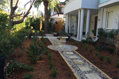 Mid-sized traditional backyard partial sun formal garden in Sydney with a garden path and decking for summer.