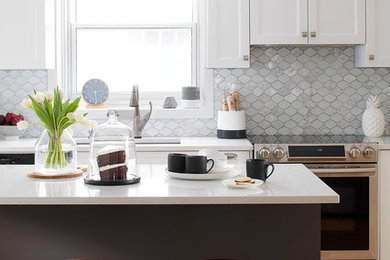 Inspiration for a contemporary light wood floor kitchen remodel in Montreal with an undermount sink, white cabinets, quartz countertops, gray backsplash, stone tile backsplash, stainless steel appliances and an island