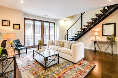 Family room - mid-sized transitional enclosed dark wood floor and brown floor family room idea in Philadelphia with beige walls and no tv