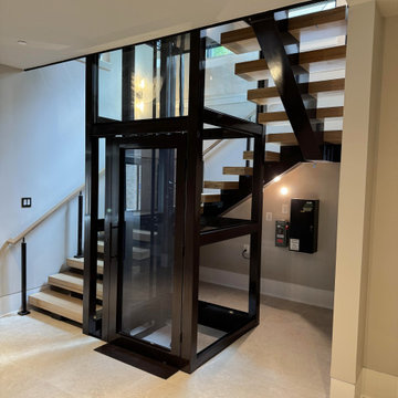 Project #136 | Modern Floating Staircase Encircling Glass Elevator