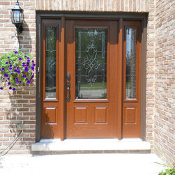 Brick Entry with Wooden Front Door & Hanging Plant - Front Doors