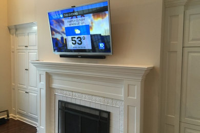 HDTV Mounted over Fireplace with Drop Down Mantel Mount and Hidden Wiring