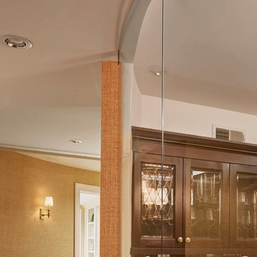 Curved Glass Panel of Lower Level Wine Cellar