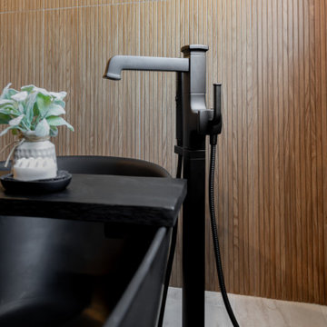 Modern Luxury Master Bathroom with Black Solid Surface Tub