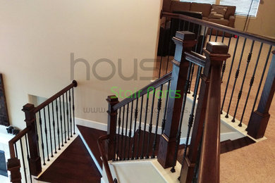 Inspiration for a large timeless wooden l-shaped staircase remodel in Houston with painted risers